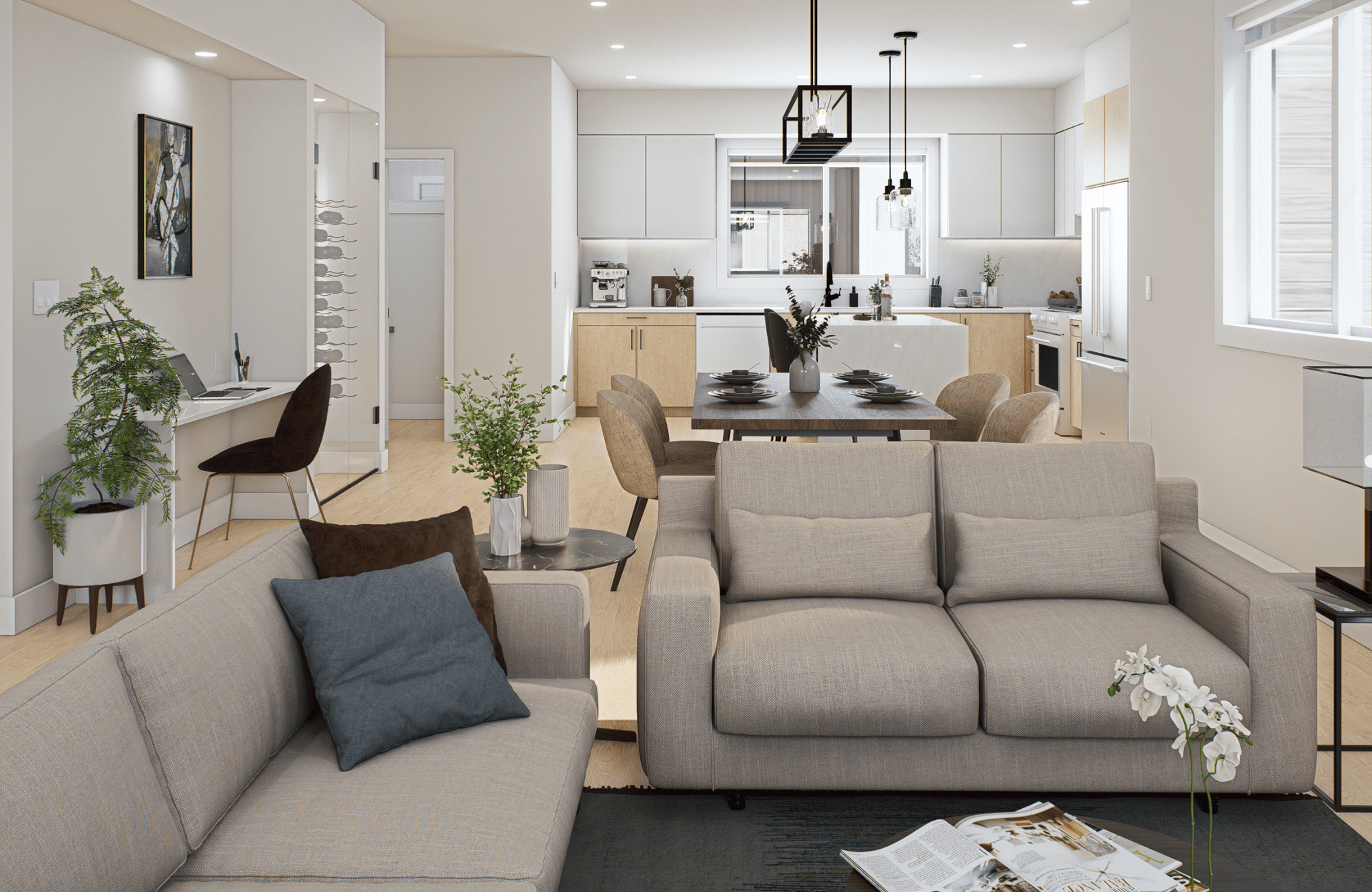 Open-concept living and kitchen area at Kings Crossing townhomes in Abbotsford, featuring dining space, built-in workspace, and modern finishes.
