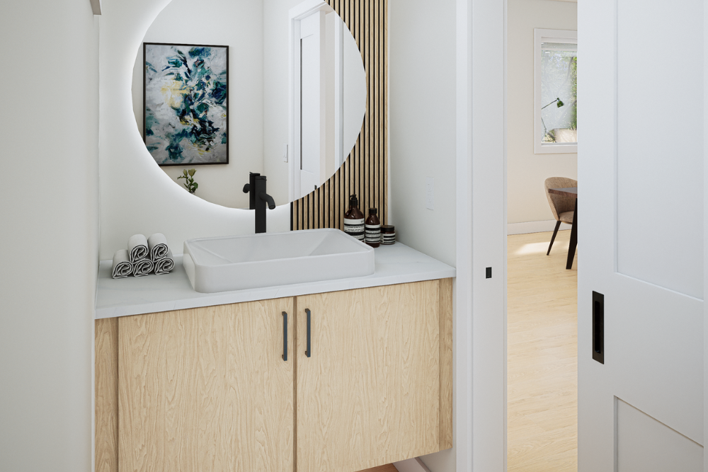 Modern bathroom vanity with backlit round mirror and sleek fixtures in townhomes for sale in Abbotsford BC near top amenities.