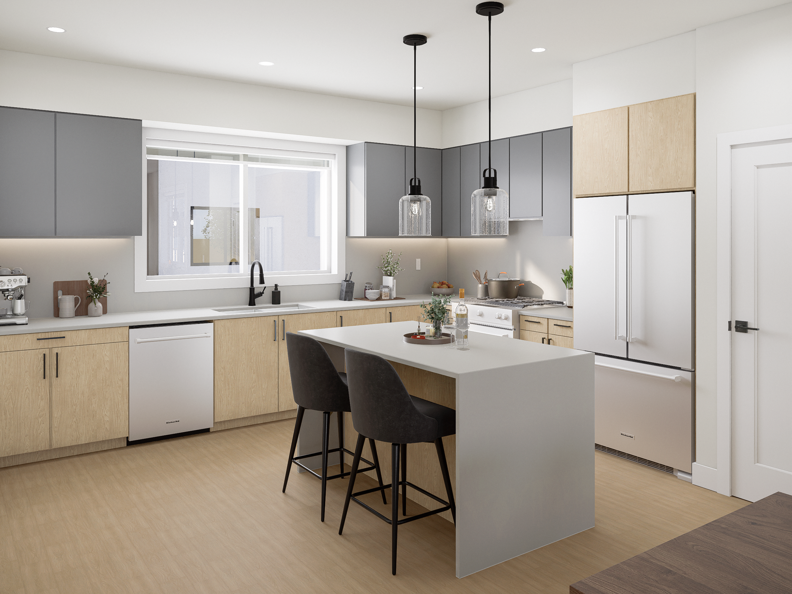 Modern kitchen interior in Kings Crossing townhome with island seating, pendant lighting, and sleek cabinetry.