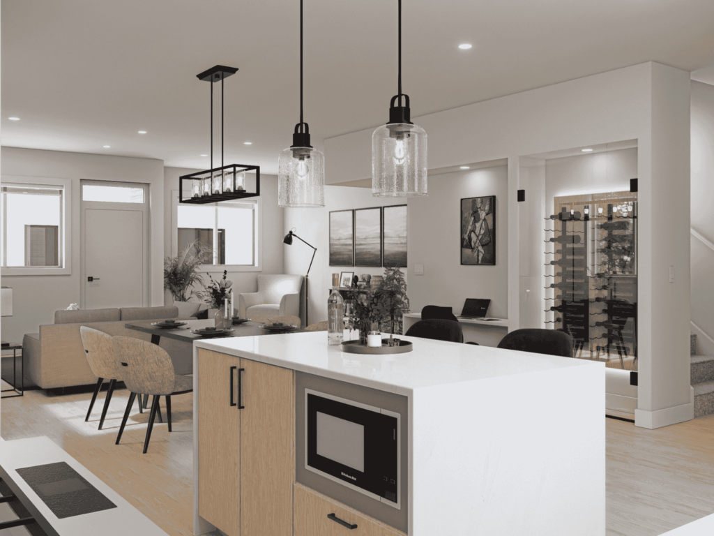 Open-concept kitchen and living space with island seating, pendant lighting, and built-in wine cellar in Kings Crossing townhomes, Abbotsford.